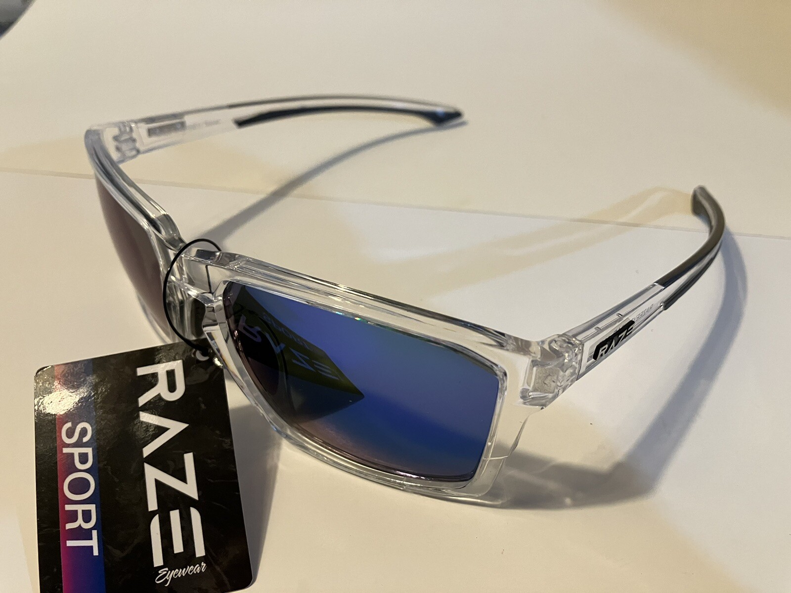 RAZE Eyewear Sunglasses Journey mirrored blue lens clear frame 26922