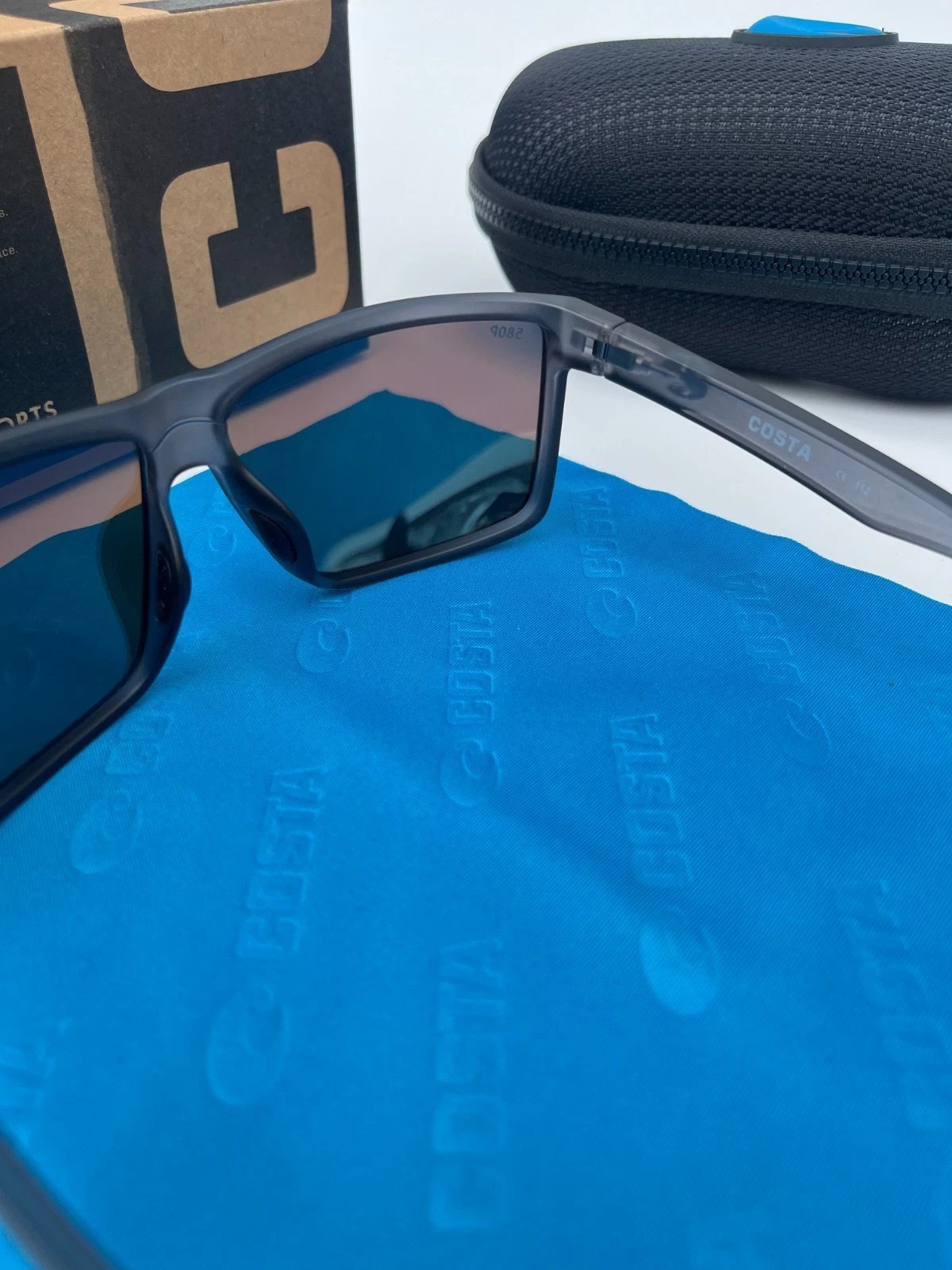 COSTA polarized – Smoke-Clear Frame W/ Blue Polarized lens