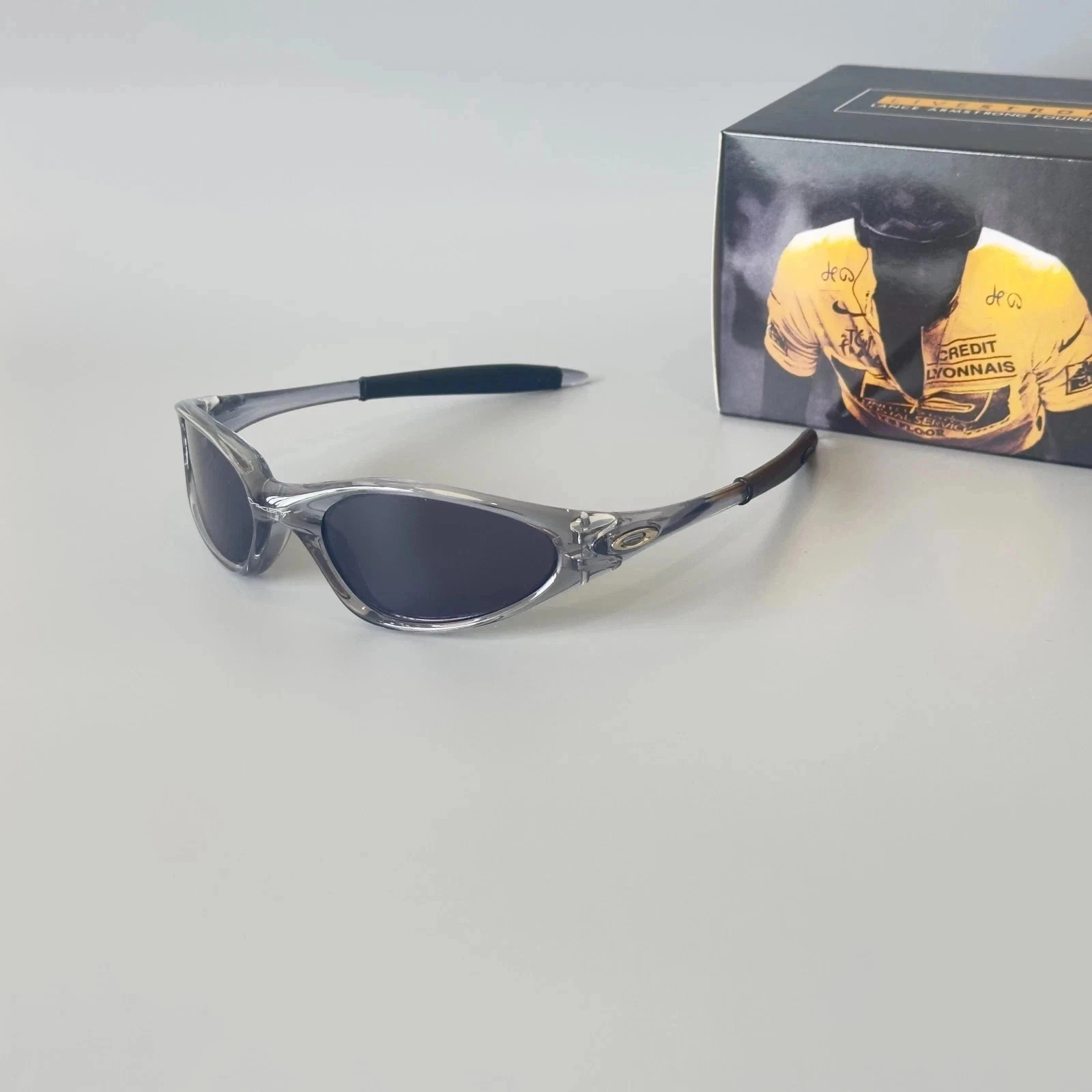 Oakley Minute Gen1 Minute 1.0 Sunglasses Transparent Gray Frame Black Lens