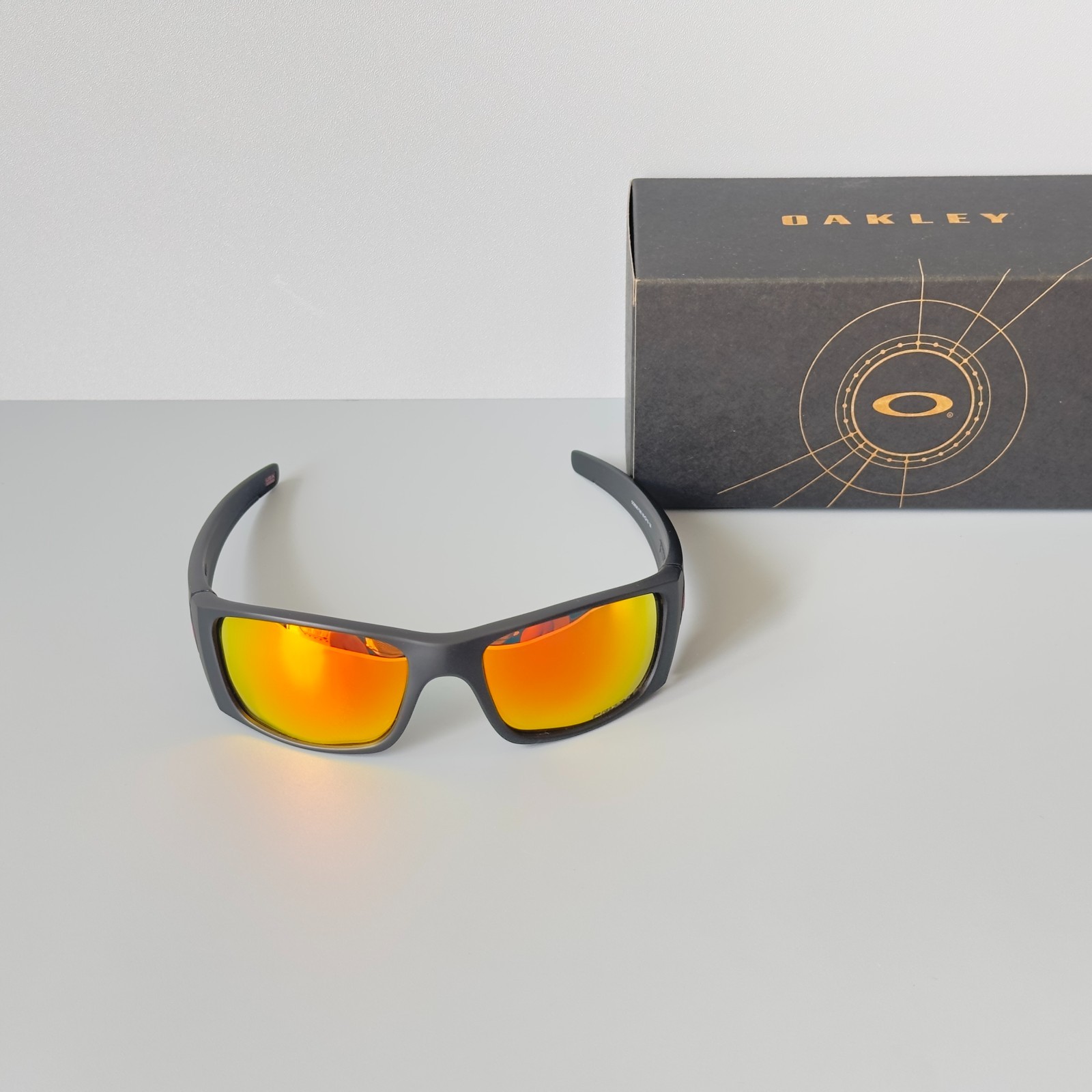 Oakley Fuel Cell OO9096 Polarized Sunglasses Matte Black Red Lens