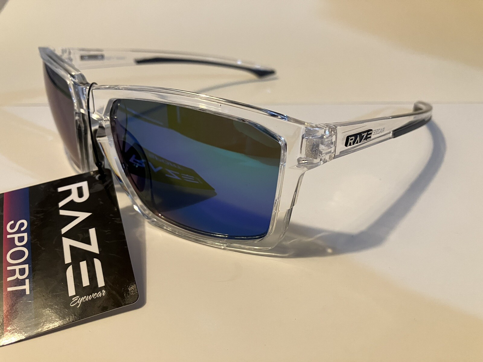RAZE Eyewear Sunglasses Journey mirrored blue lens clear frame 26922