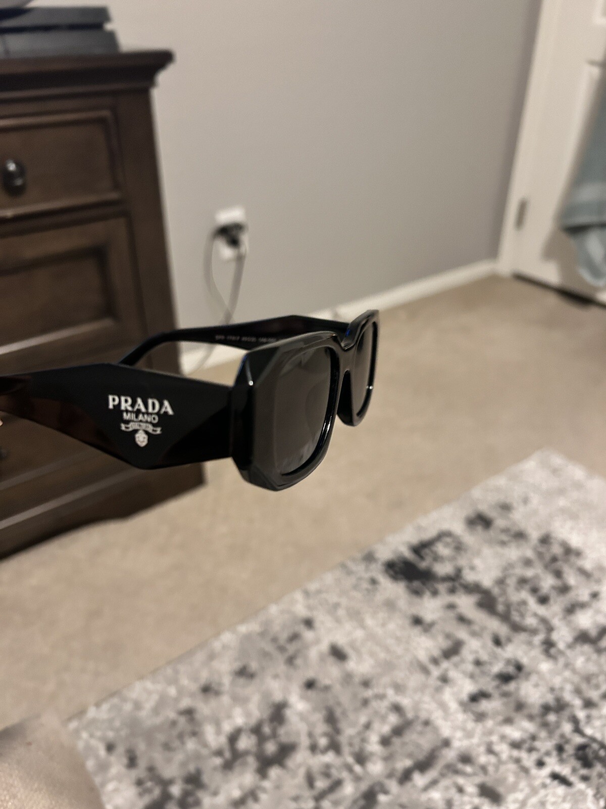 PRADA PR 27ZS Men’s Irregular Sunglasses – Black/Gray (PR 27ZS 16K08Z 54)