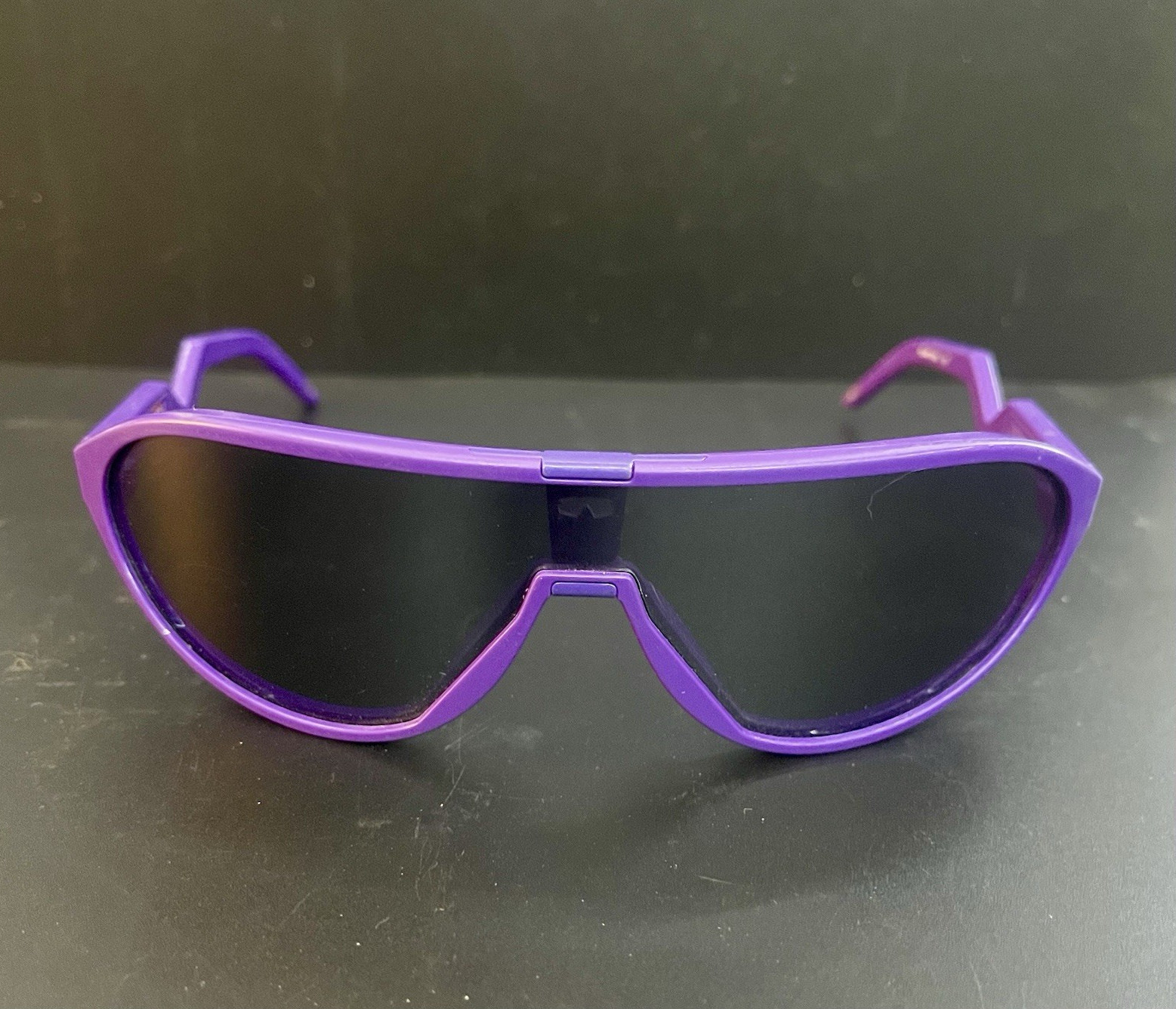 Oakleys in Electric Purple with Prizm Black lenses.