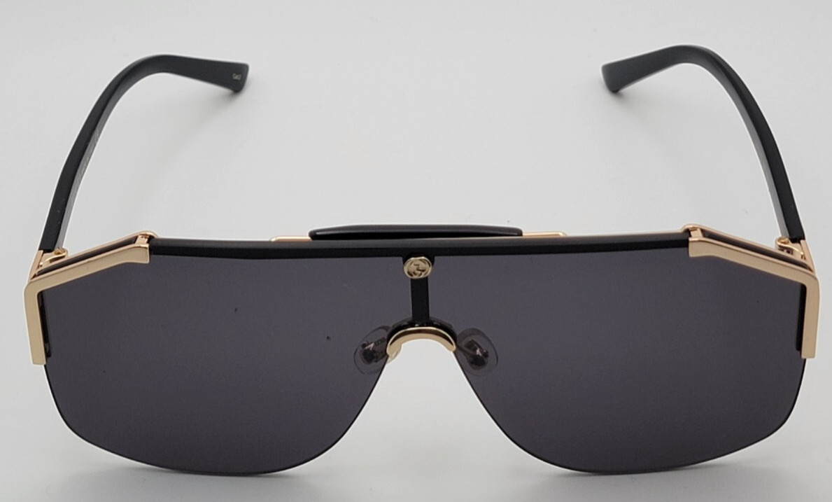 Gucci GG0291S Men’s Sunglasses Oversized Shield Black/Gold Metal Frame Gray Lens
