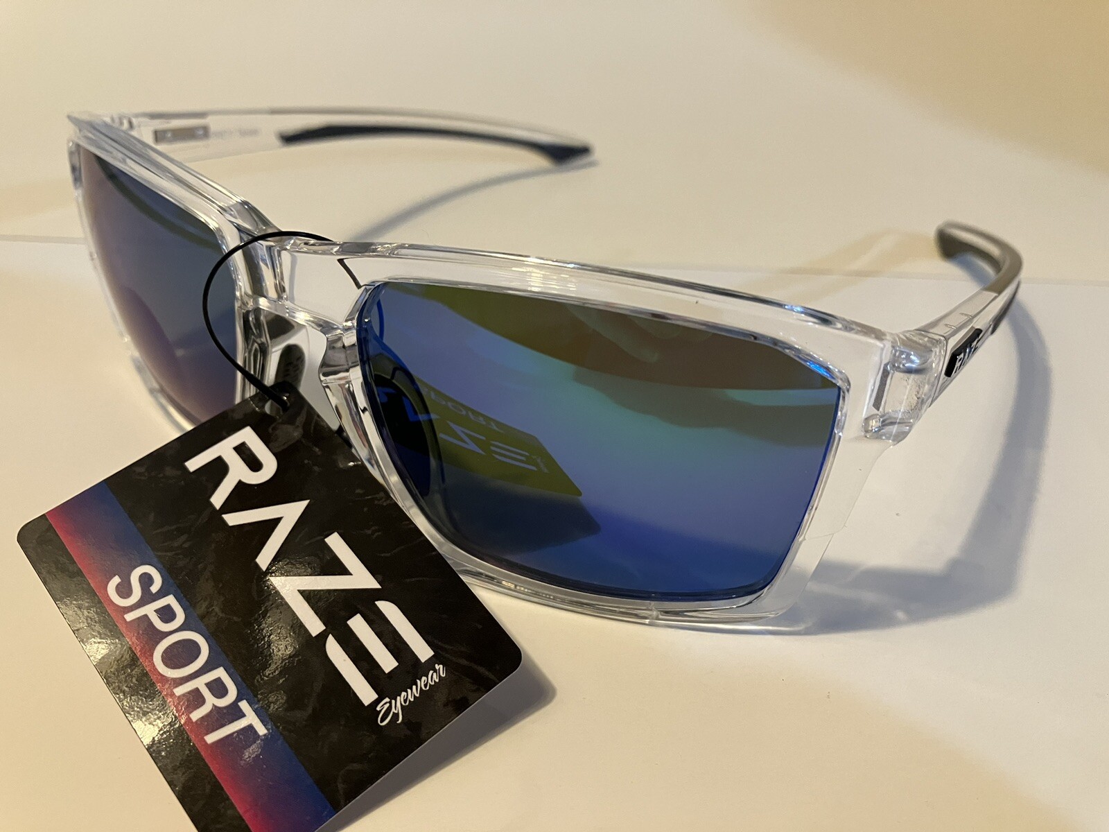 RAZE Eyewear Sunglasses Journey mirrored blue lens clear frame 26922