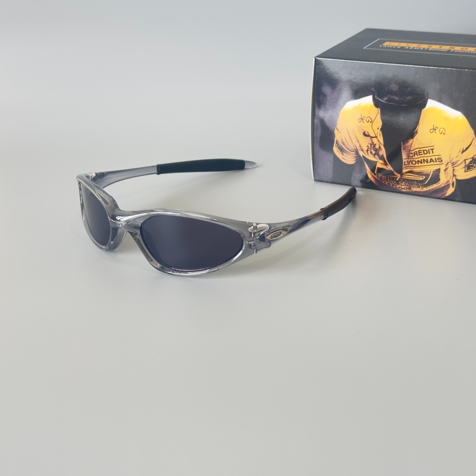 Oakley Minute Gen1 Minute 1.0 Sunglasses Transparent Gray Frame Black Lens
