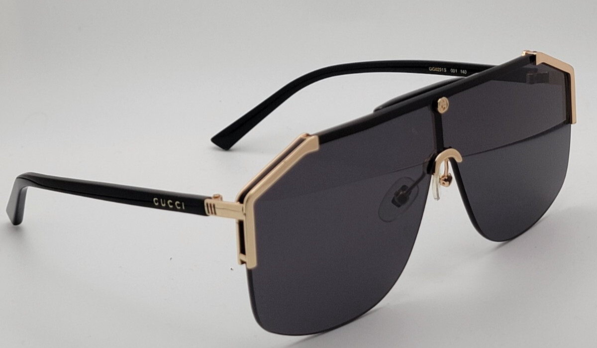 Gucci GG0291S Men’s Sunglasses Oversized Shield Black/Gold Metal Frame Gray Lens