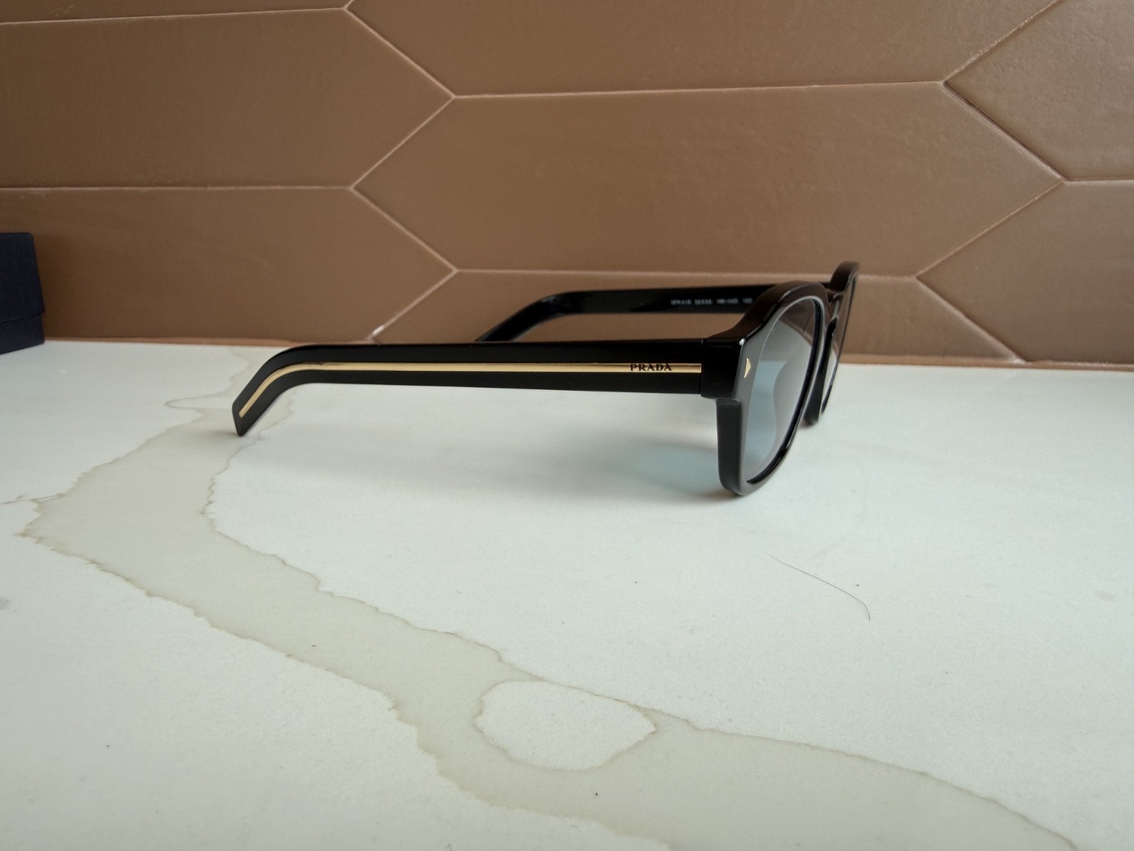 PRADA PR A16S Sunglasses with turquoise blue lenses