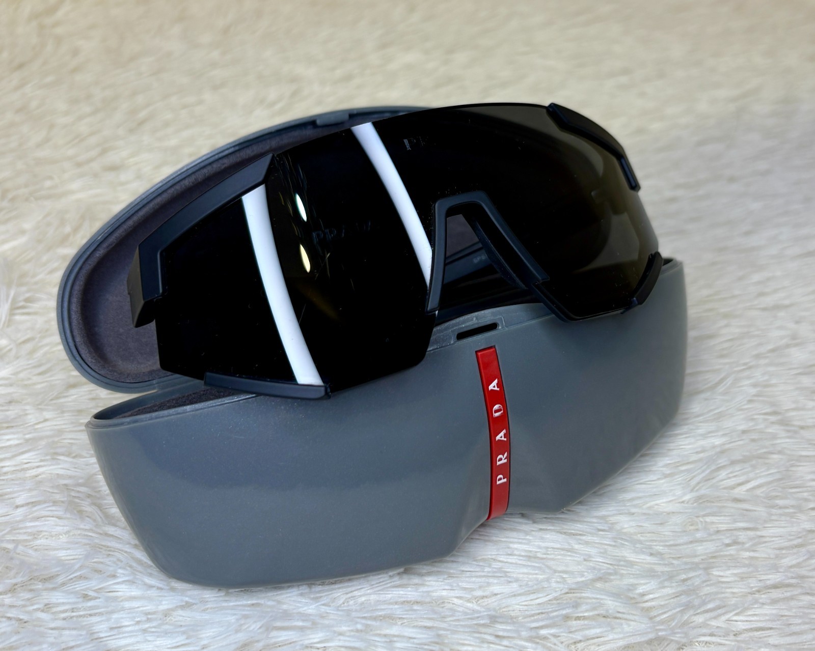 Large-size PRADA Eyewear sports sunglasses. 100% original