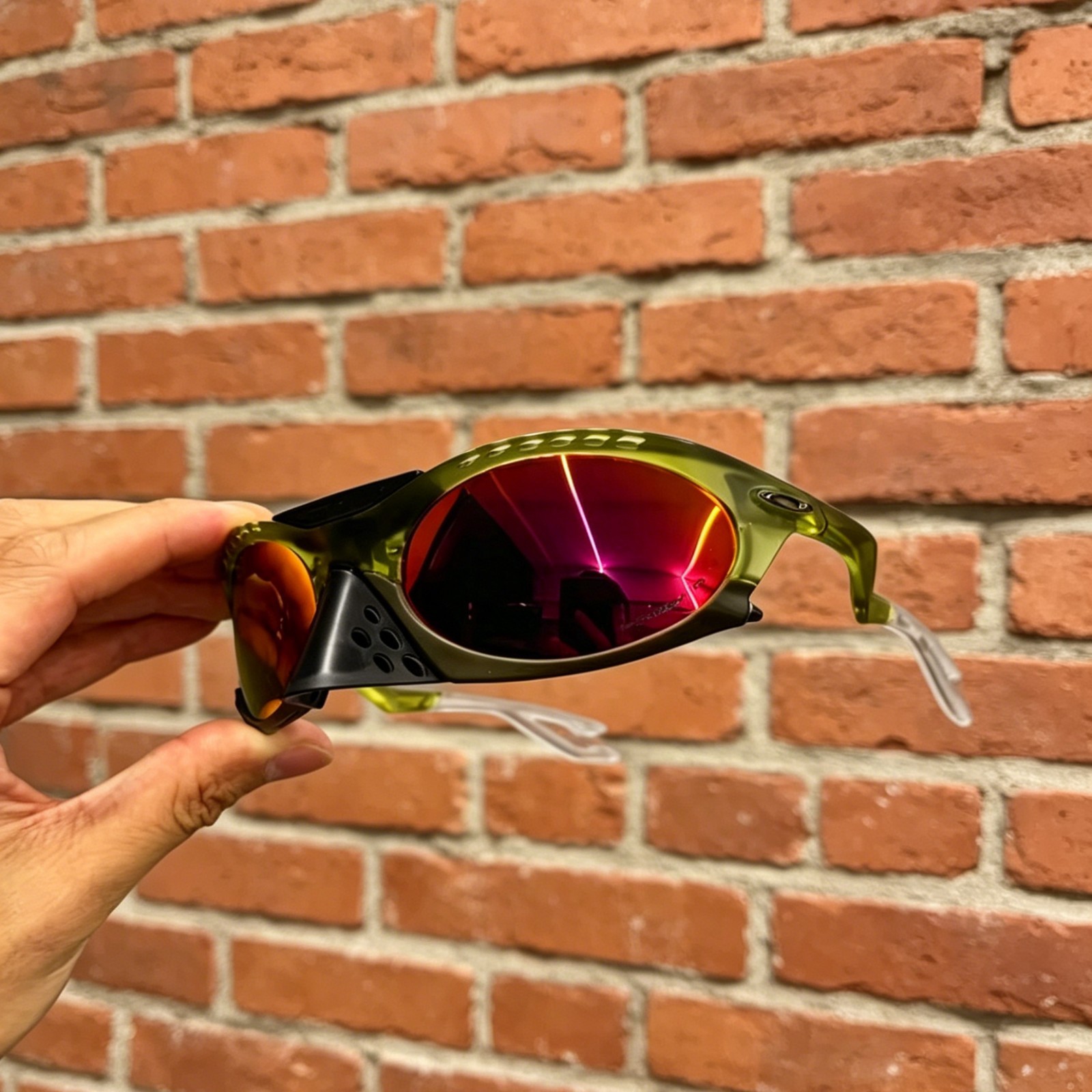 Oakley Plantaris Travis Scott OO9437 Sunglasses Clear Green Frame Ruby Lenses