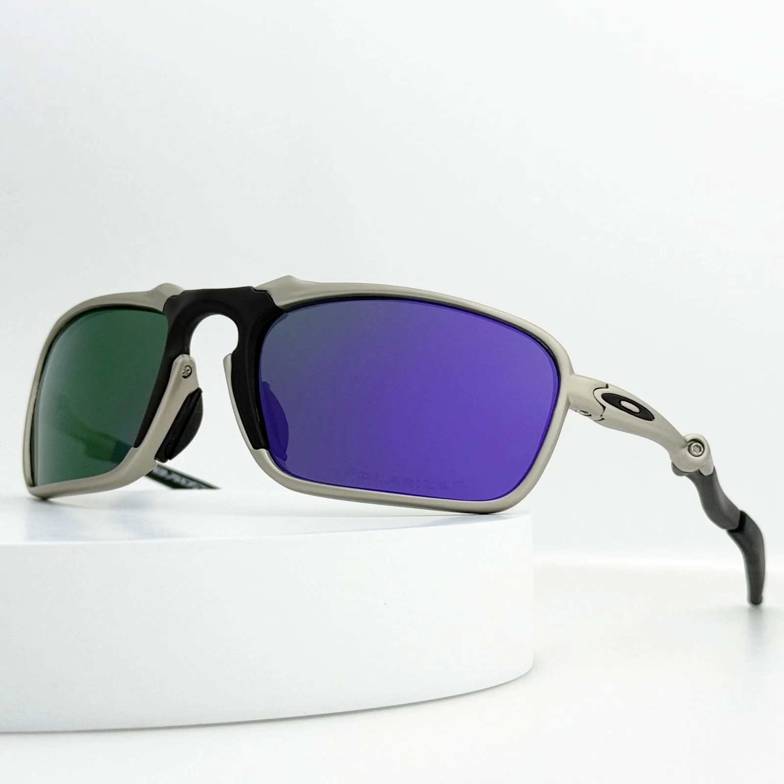 Oakley Badman OO6020 X-Metal Polarized Sunglasses Silver Frame Purple Lens