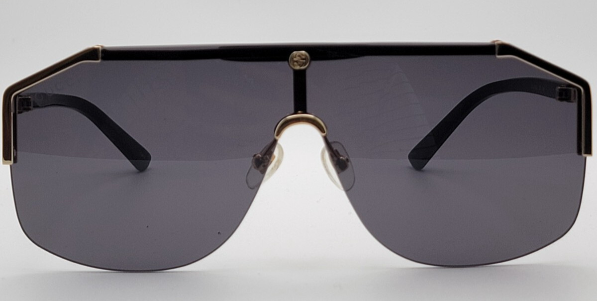 Gucci GG0291S Men’s Sunglasses Oversized Shield Black/Gold Metal Frame Gray Lens