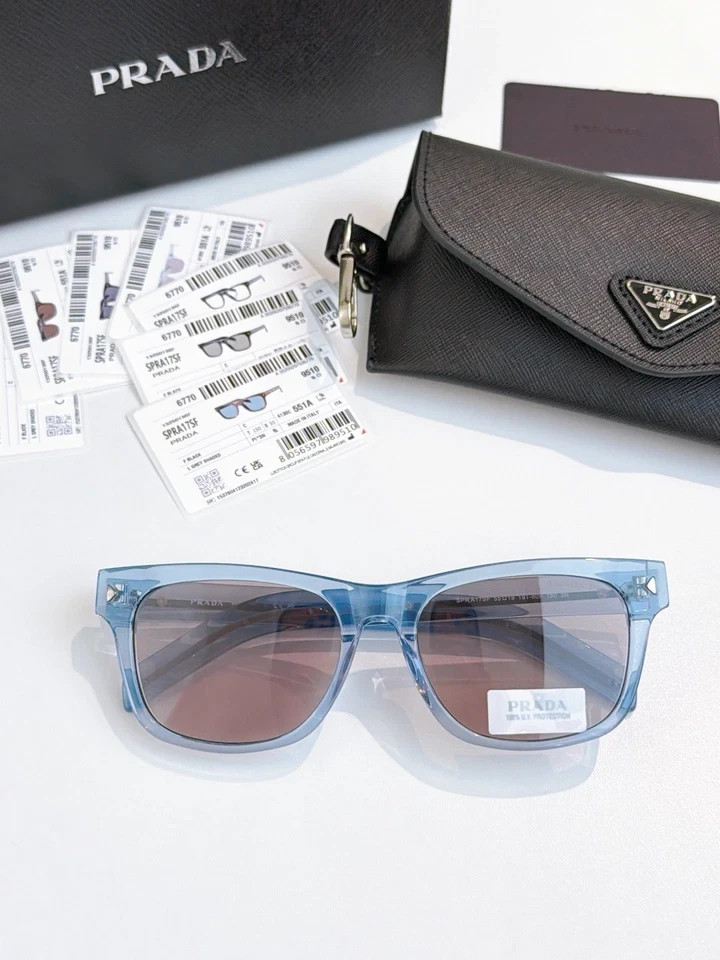PRADA SPRA17SF Unisex Sunglasses Transparent Ice‑Blue Frame Dusty Pink Lens 55MM