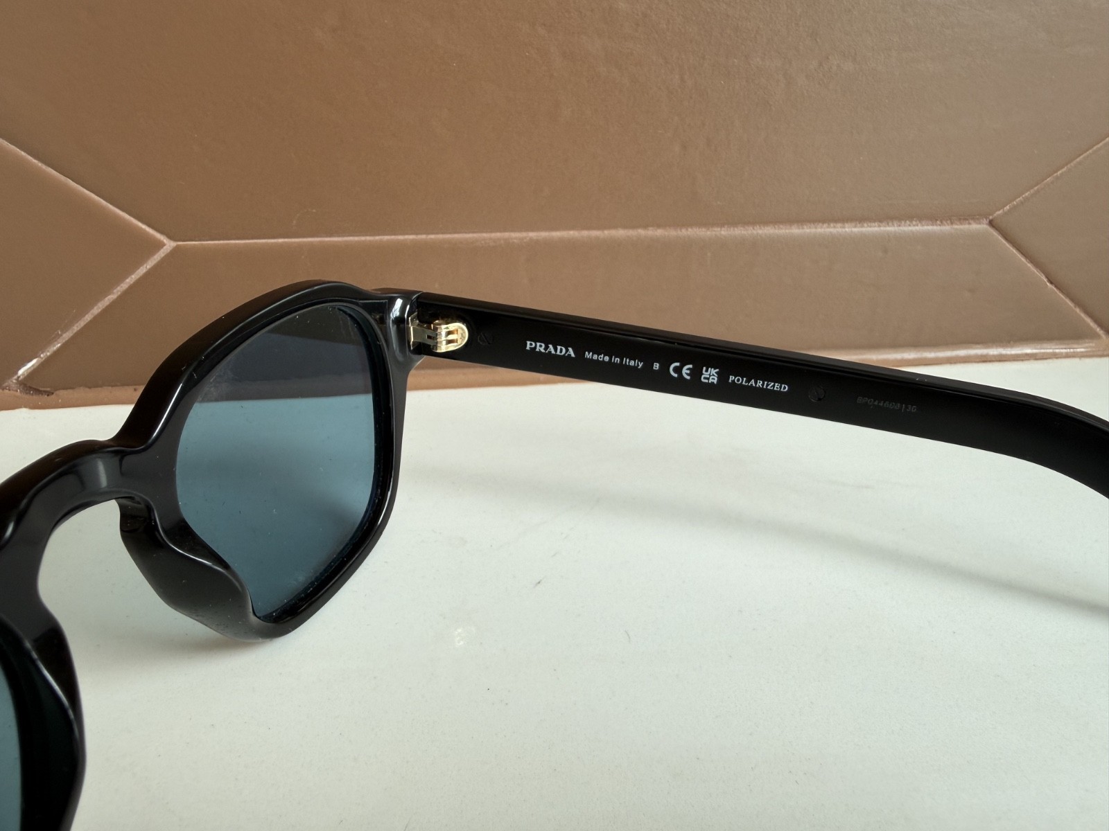 PRADA PR A16S Sunglasses with turquoise blue lenses