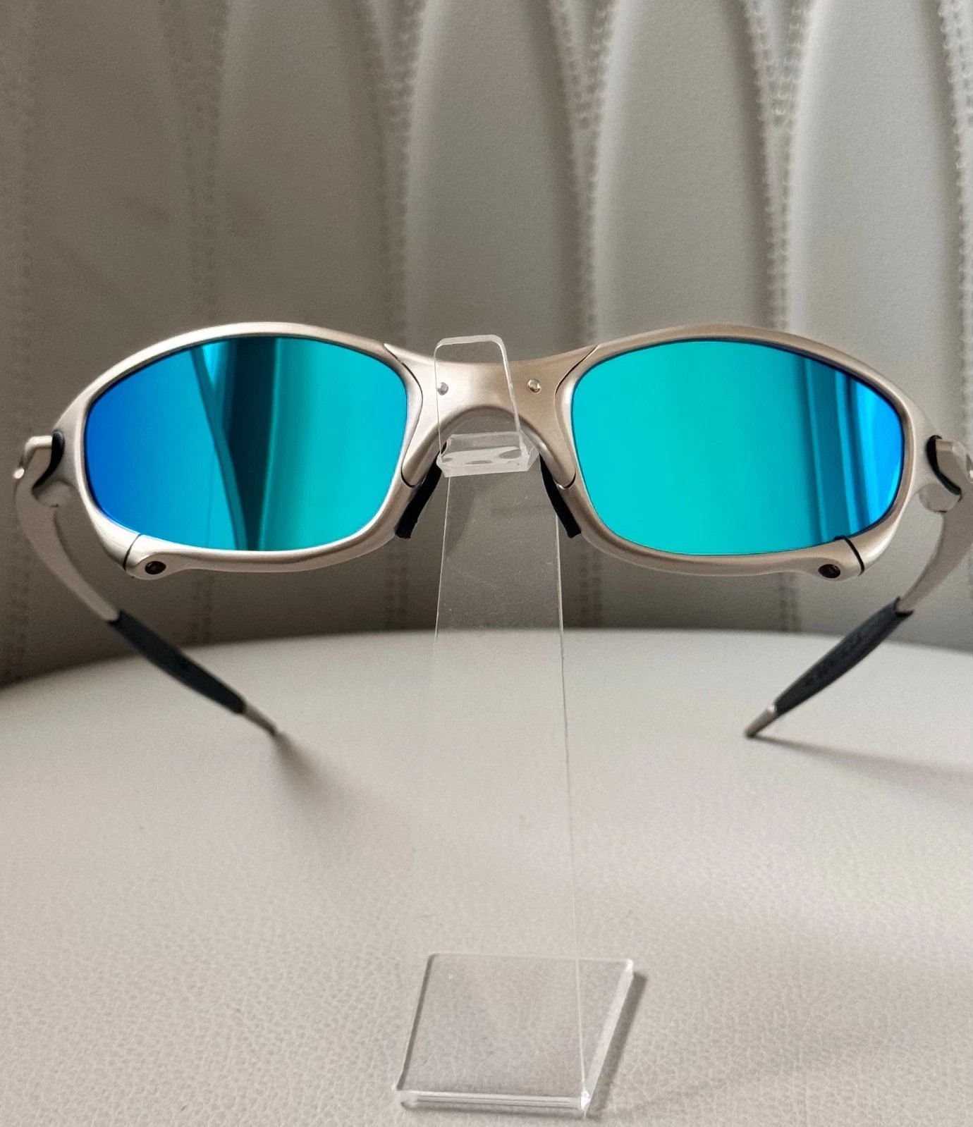 Oakley Juliet 1.0 X sunglasses, silver metal frame. Icy blue lenses