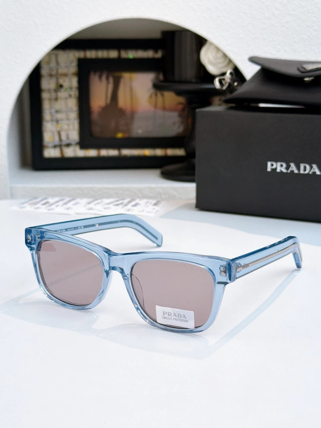 PRADA SPRA17SF Unisex Sunglasses Transparent Ice‑Blue Frame Dusty Pink Lens 55MM