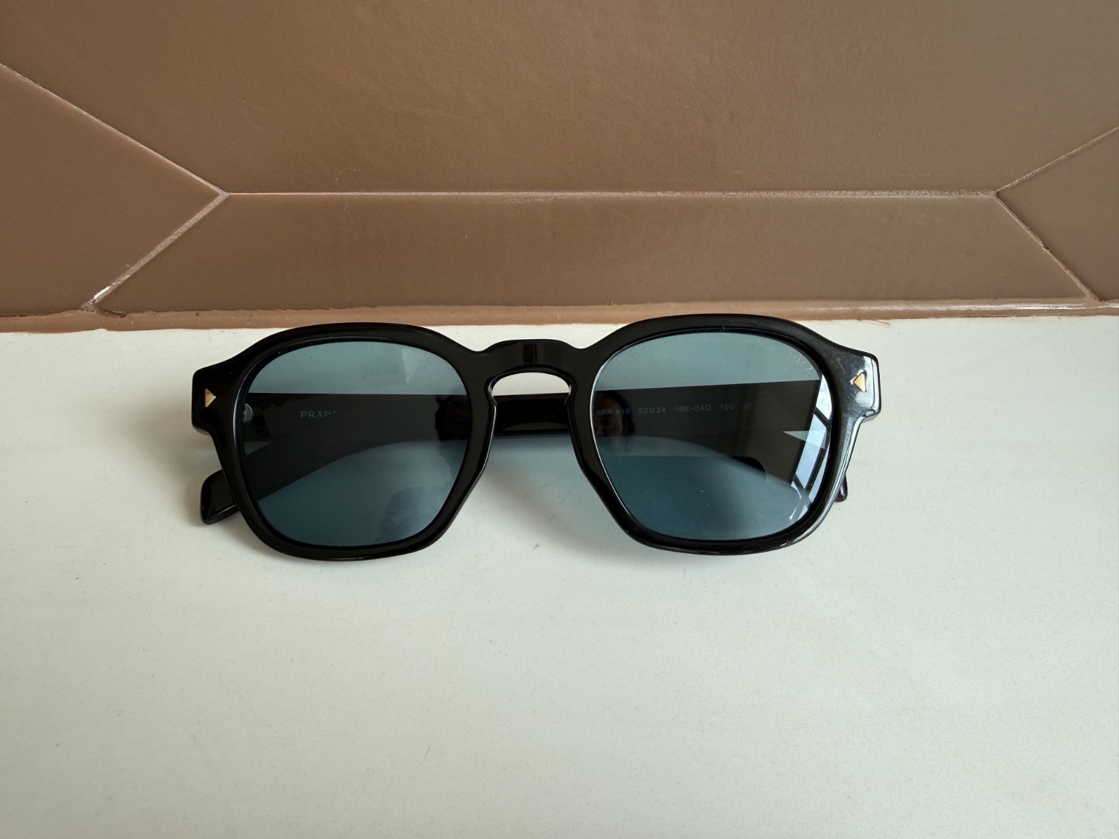 PRADA PR A16S Sunglasses with turquoise blue lenses