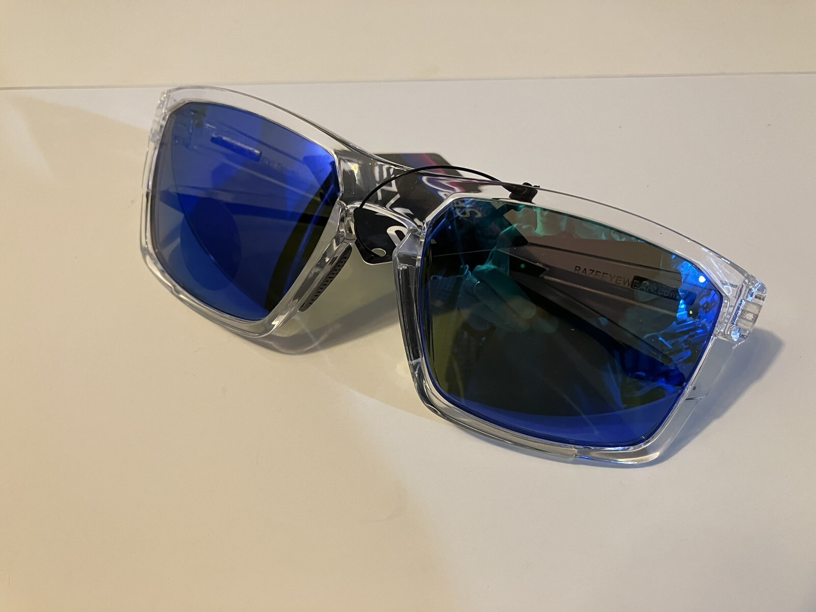 RAZE Eyewear Sunglasses Journey mirrored blue lens clear frame 26922